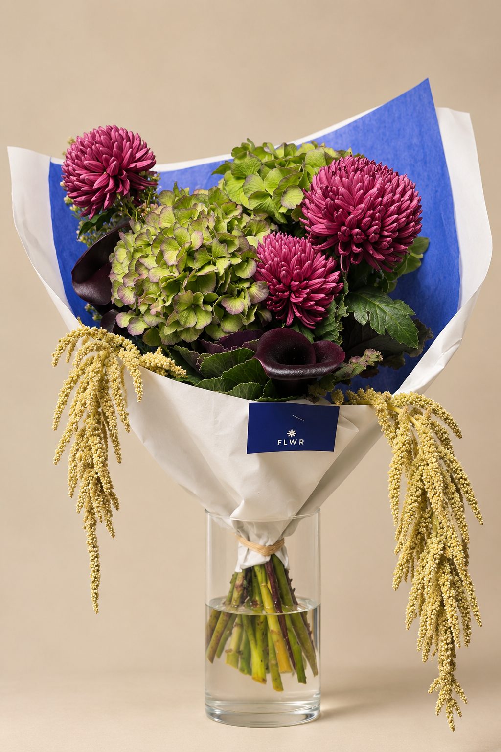 Custom FLWR bouquet: raspberry chrysanthemums, green hydrangeas, ornamental cabbage, black calla lilies and hanging amaranth